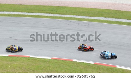 SEPANG, MALAYSIA - OCT. 21: Three MotoGP riders in action during practice session of Shell Advance Malaysian Moto GrandPrix on Oct. 21 2011 in Sepang, Malaysia.