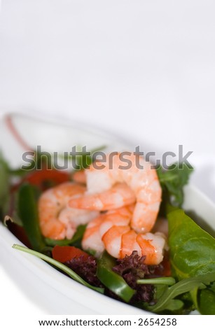 Tiger Prawn with mixed salad and peppers in white dish
