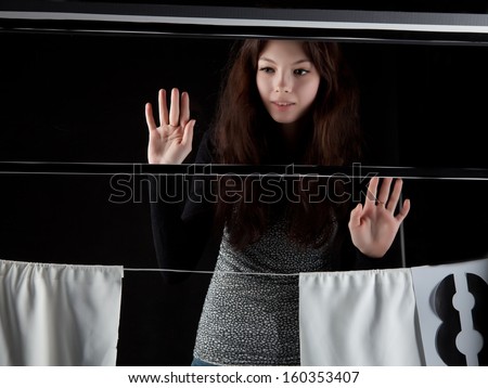 long awaited meeting girl outside the window on dark background