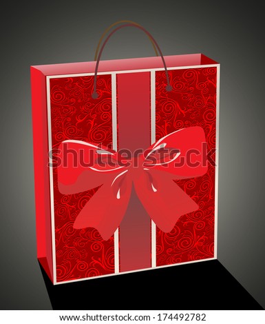 Empty glossy red gift bag decorated with ribbons and a bow