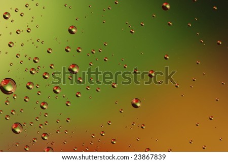 Clean waterdrops on green - red background