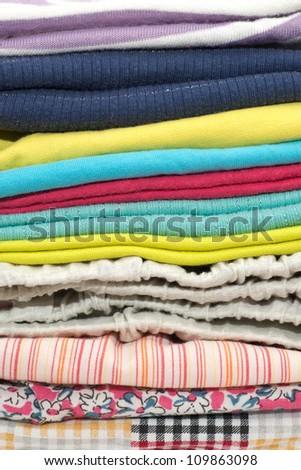 a stack of clothes on white background