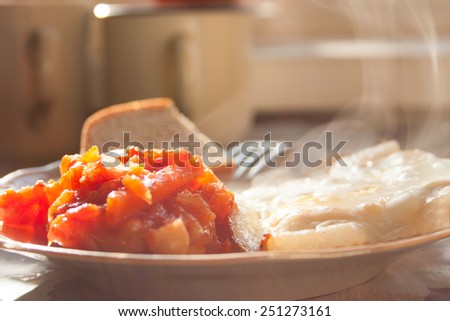 Scrambled Steaming Eggs with Vegetables and Bread on the Plate