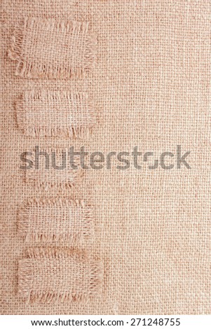 Vertical Burlap Background with Patches Placed like a Stickers