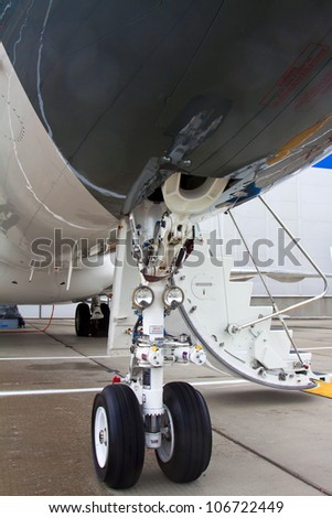 front landing gear and open ladder in light aircraft on the ground