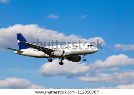 white jet passenger aircraft with the gear against the blue sky