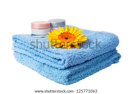 blue towel, gerbera and chrysanthemum isolated on white background