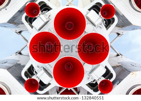 rocket engine and red nozzle engines on blue sky background