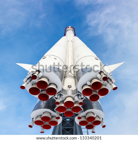 rocket engine and red nozzle engines on the background of blue sky