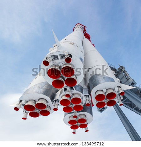 rocket engine and red nozzle engines on the background of blue sky