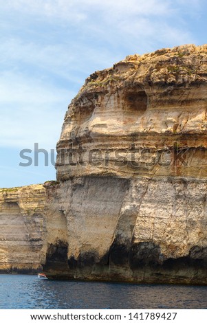 Skull Rock. Malta, Gozo Island, view of the rocky coastline of the island at Dwejra