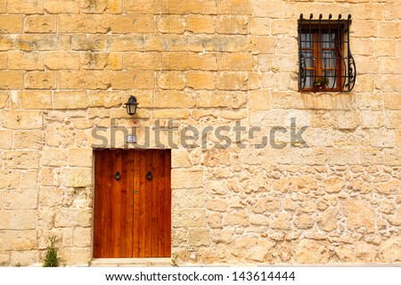 old wooden front door to the house in the Mediterranean