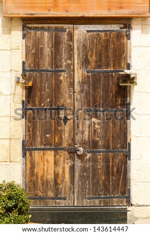 old wooden front door to the house in the Mediterranean