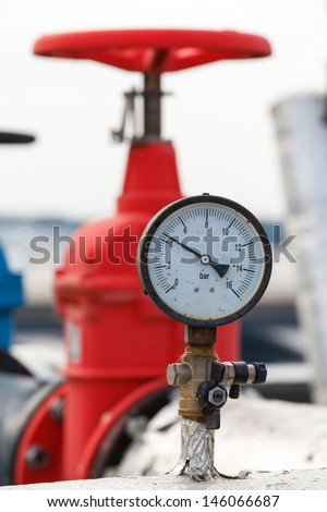 manometer, red valve on hot pipe