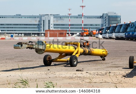 The towing hitch carrier for aircraft and truck on the ramp at the airport