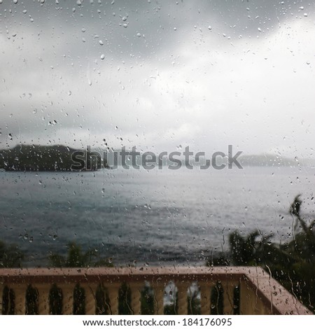 terrace in the colonial style in the rain with an ocean view, Seychelles