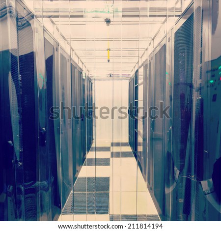 racks in the data center in the cold aisle through the transparent curtains