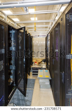 open racks in the data center, the cold aisle and equipment on the floor