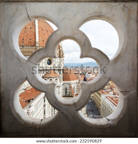 views of the Cathedral Santa Maria del Fiore through the fence ornament bell tower in Florence, Italy