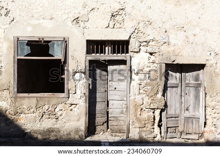 old vintage wooden door and window in a house on the island of Sardinia, Italy