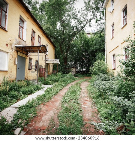 passage and the road in the slums, wood waste and debris, Russia
