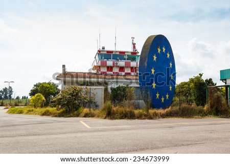 abandoned airport control tower and symbol of European Union. Italy