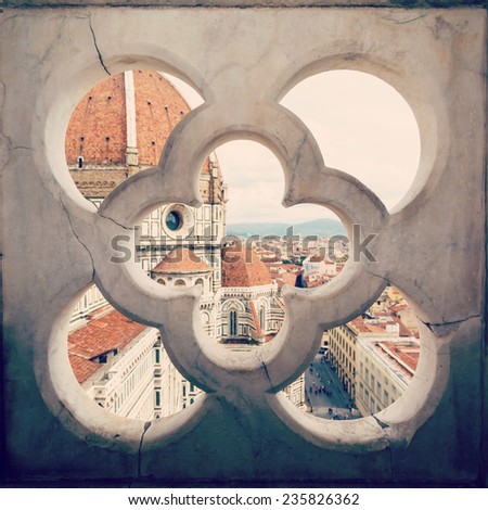 views of the Cathedral Santa Maria del Fiore through the fence ornament bell tower in Florence, Italy