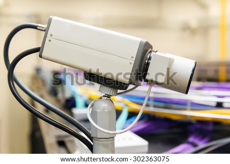 video monitoring and Large group of lilac utp Internet cables in rack data center