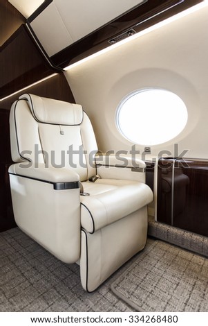 Luxury interior in bright colors of genuine leather in the business jet