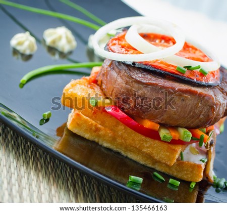 A steak is generally a cut of meat  perpendicular to the muscle fibers, usually grilled, pan-fried, or broiled