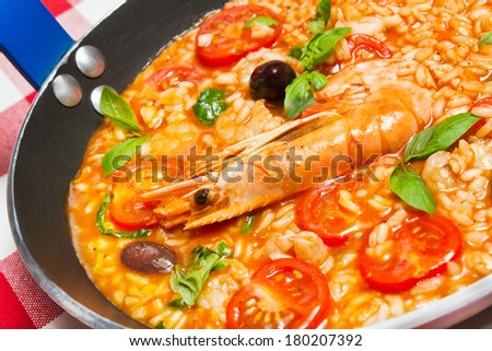 Risotto con Gamberi, or Rice with Prawns in skillet pan for one person. See more Italian food. Naples