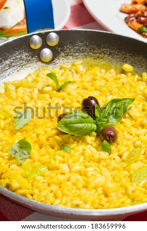 Risotto alla milanese. Made with beef stock, beef bone marrow, lard (instead of butter) and cheese, flavored and colored with saffron