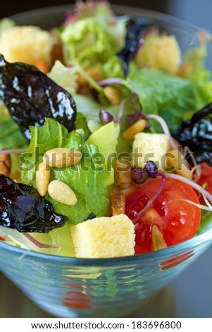 Close-up shot of a fresh salad in a glass. Natural lighting