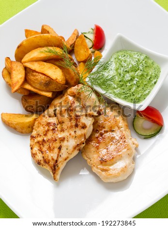 Grilled Chicken breasts served with potato fries and spinach dip. See more chicken in my gallery