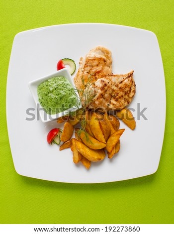 Grilled Chicken breasts served with potato fries and spinach dip. See more chicken in my gallery
