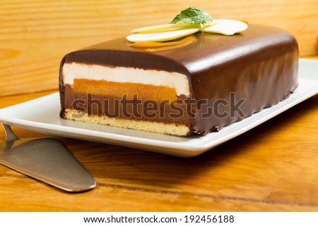 Chocolate dessert with mango and white cream. See more in my gallery