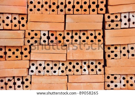 Heap of red bricks close up