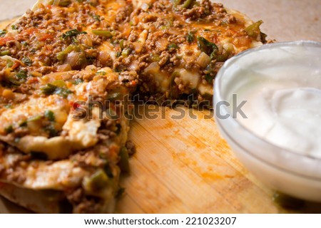 Traditional Turkish food ;Layers of Flat Breads with Ground Meat and Vegetable Topping which called Yaglama in Kayseri/Turkey