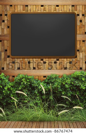 empty blackboard with wooden frame on wood wall