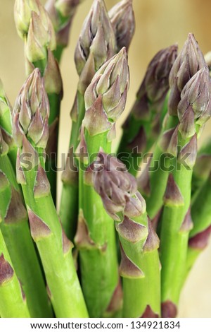 Closeup of a bundle of fresh purple asparagus