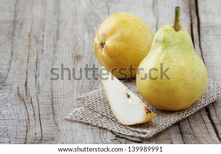 Delicious Williams pears on a rustic wooden table. With copy space