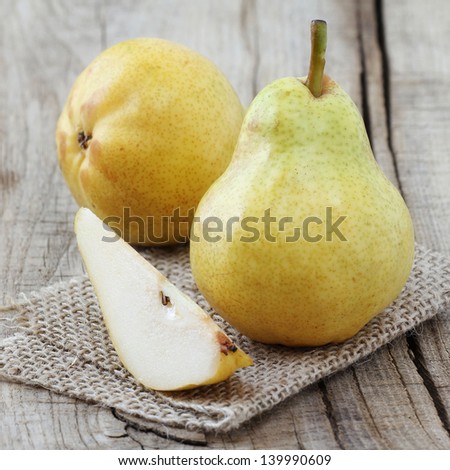 Delicious Williams or Bartlett pears on a rustic wooden kitchen table