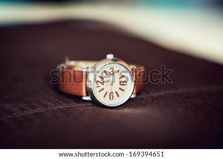 wrist watch with brown strap is very interesting