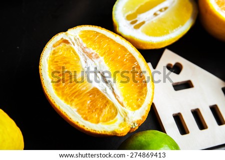 sliced citrus fruit on a black background. food