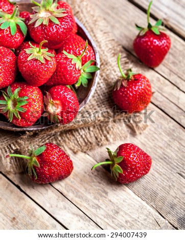 fruit. Fresh strawberries on old wooden background
