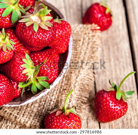 fruit. Fresh strawberries on old wooden background