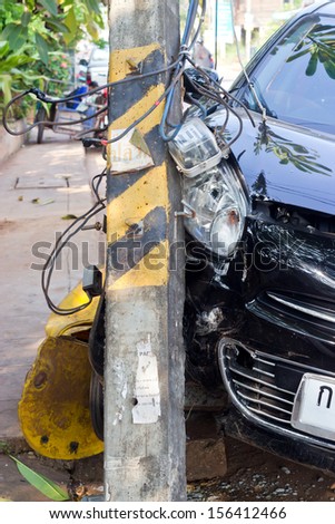 The image of car crashes into electricity pole