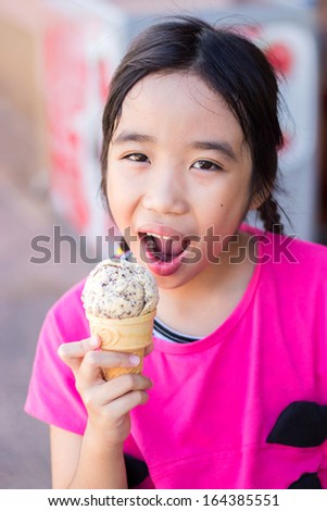 Cute asian girl with ice cream