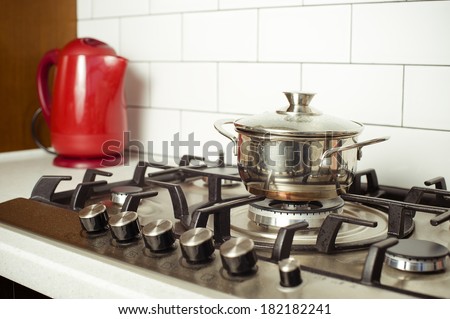 Close-up of  gas stove with a pan in traditional kitchen