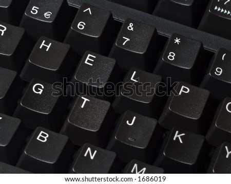 Black keyboard with the letters spelling help.